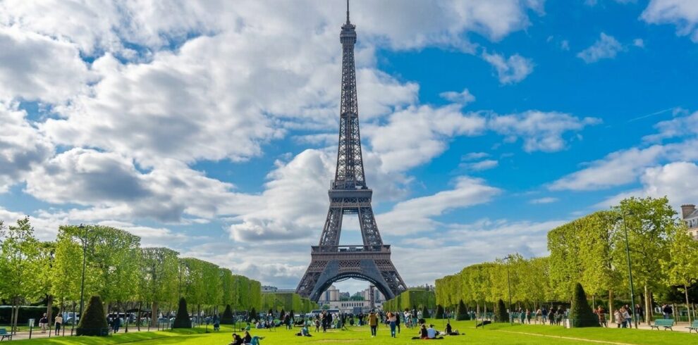 Eiffel Tower in Paris during Europe tour with tourists enjoying iconic landmark