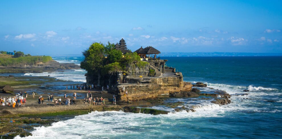Tanah Lot Temple on rocky coastline in Bali Indonesia during iconic Indonesia tour