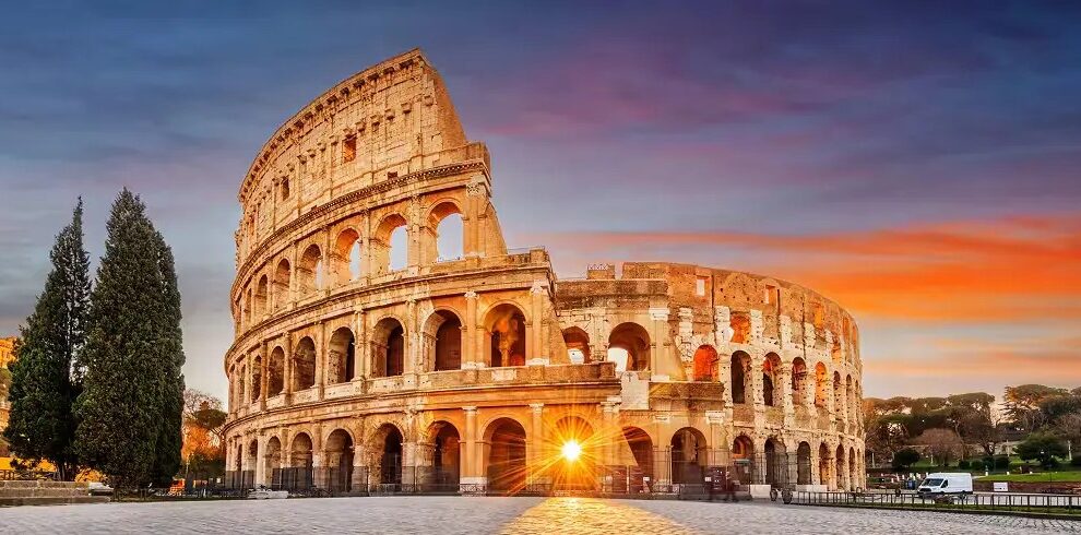 Explore Europe tour packages with the iconic Colosseum in Rome during a stunning sunset city experience