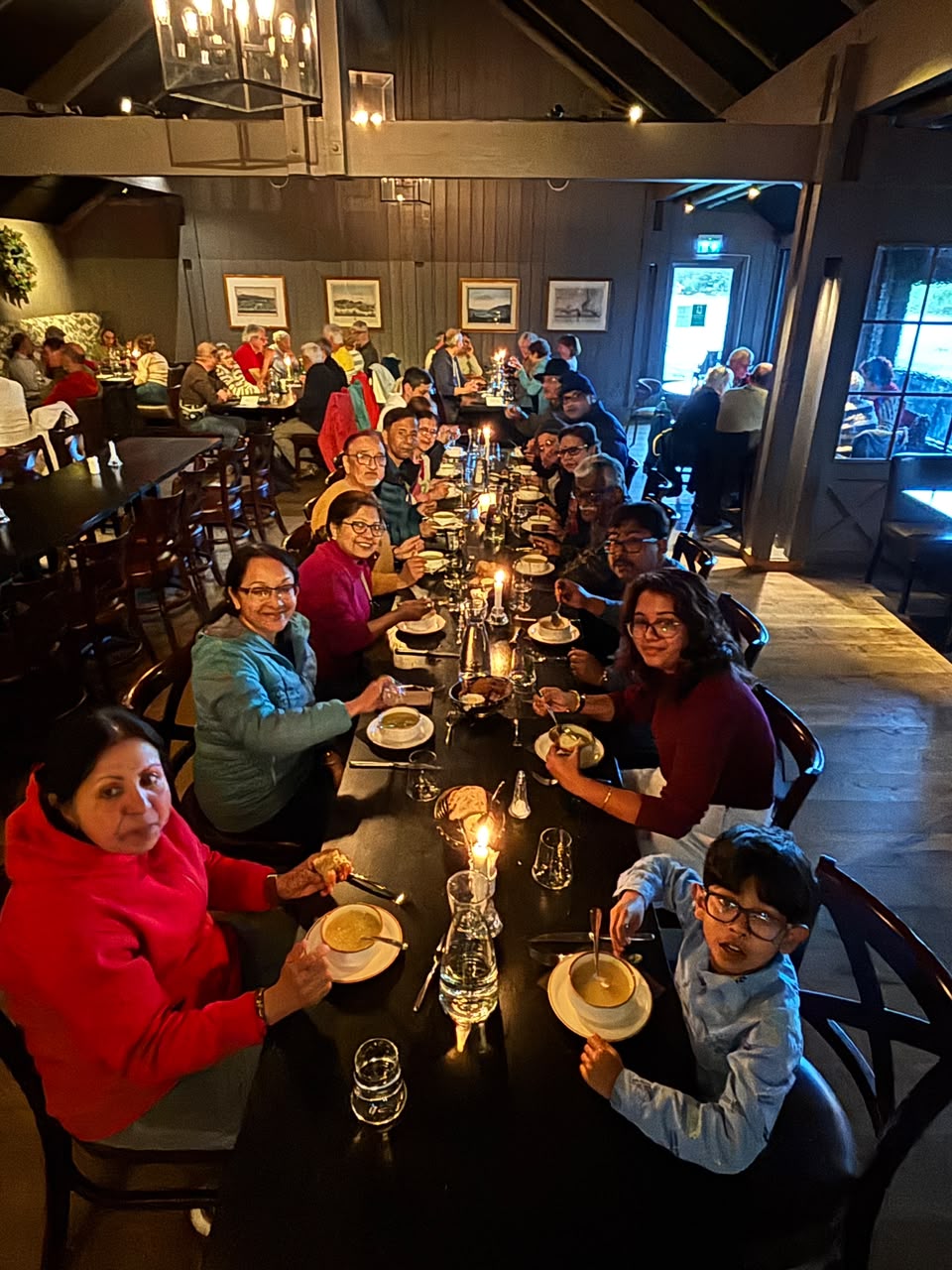 Families enjoying dinner together during an international group tour with Aviana Holidays