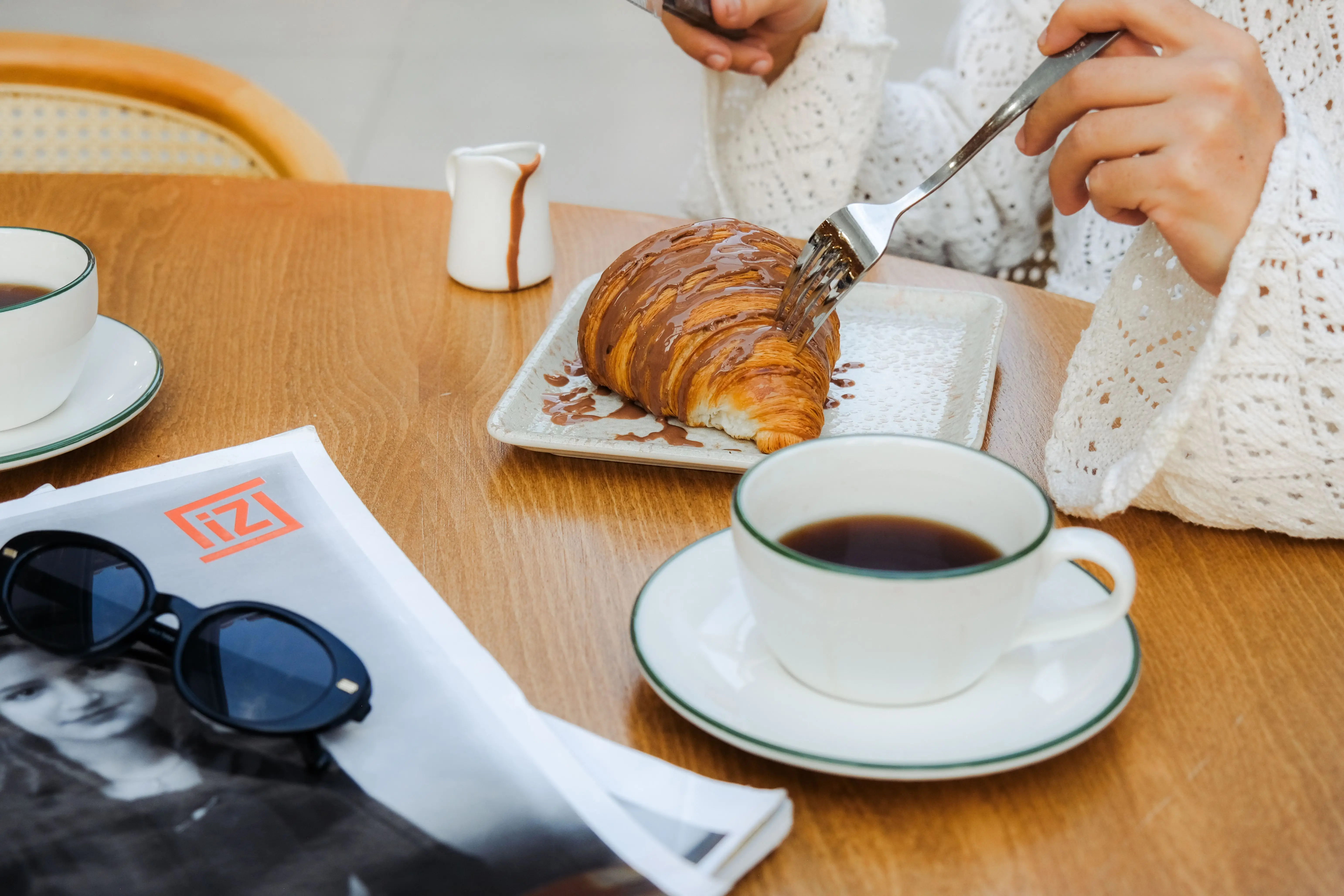Coffee and chocolate croissant during a Paris food experience