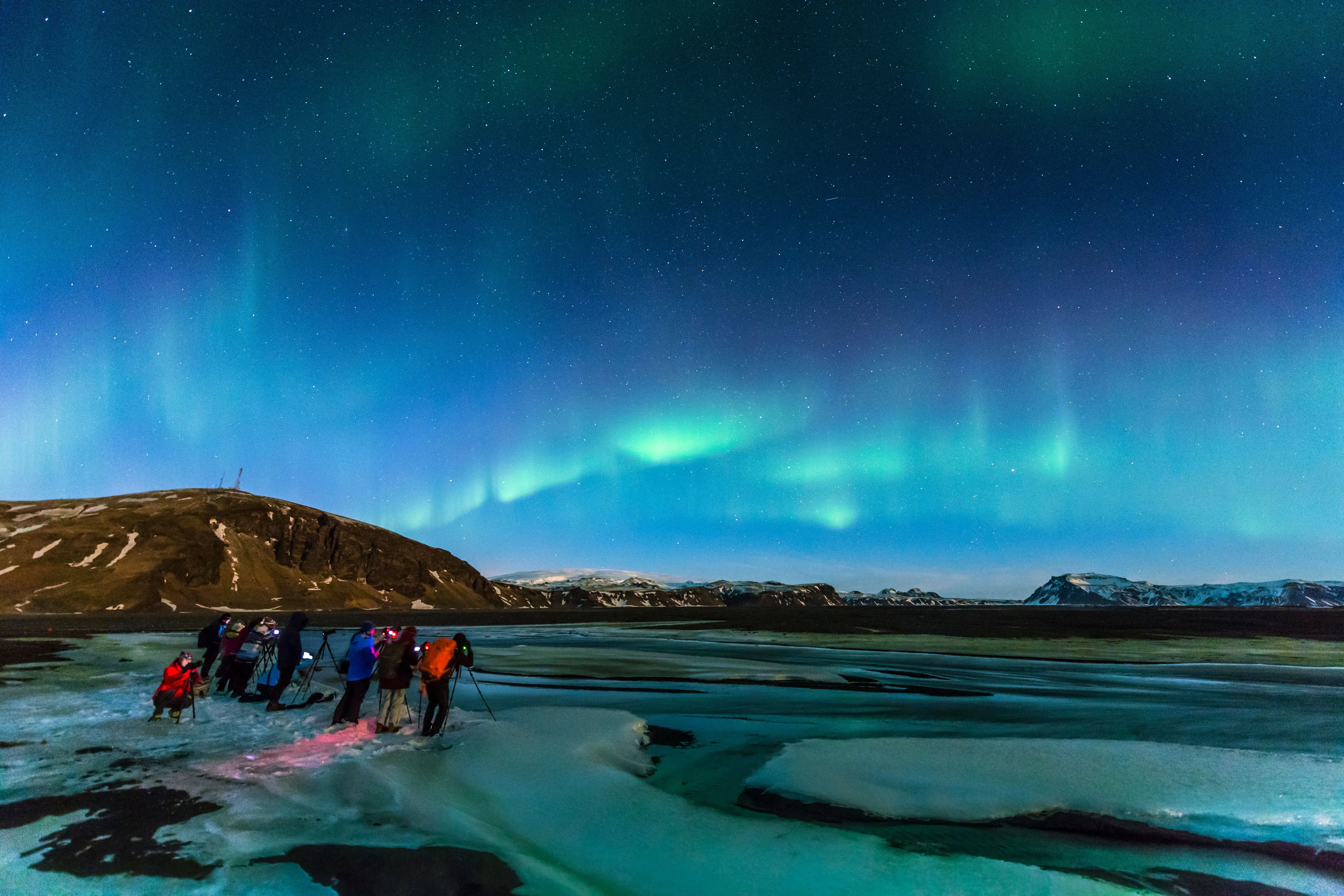 Majestic iceberg floating on the crystal-clear waters of Jökulsárlón Glacier Lagoon in Iceland, featured in the Cinematic Iceland tour by Aviana Holidays