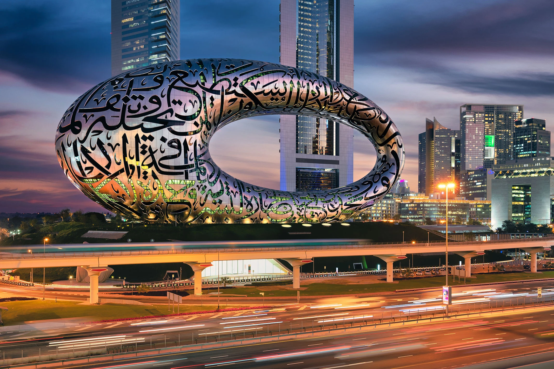 Explore Dubai tour packages with the iconic Museum of the Future illuminated in the evening skyline
